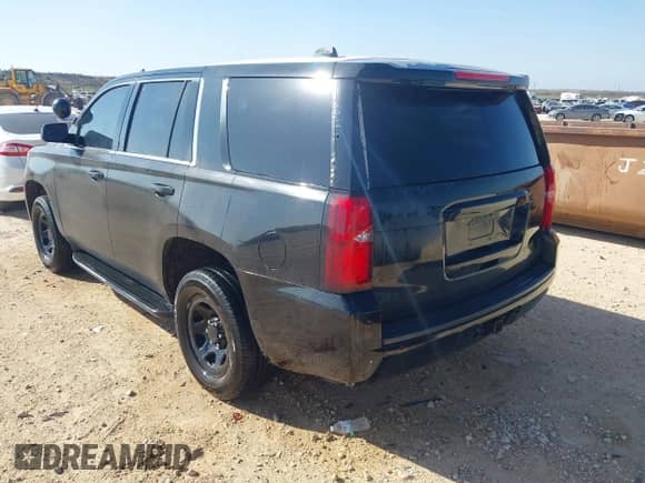 2015 Chevrolet Tahoe Commercial with VIN 1GNLC2EC7FR575386, listed as a IAAI auction lot 41836137 with 143,231 mi miles and . Bid and sale history available at DreamBid. Image 3.