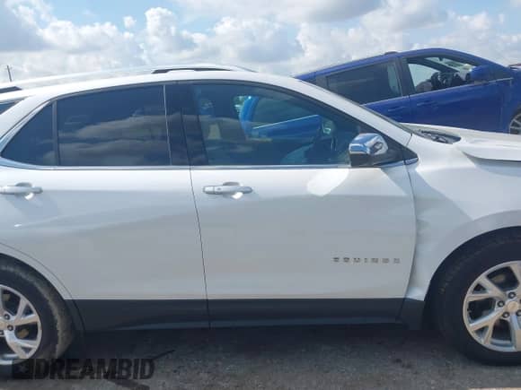 2021 Chevrolet Equinox Premier with VIN 3GNAXNEV2MS147136, listed as a IAAI auction lot 42929222 with 61,778 mi miles and . Bid and sale history available at DreamBid. Image 13.