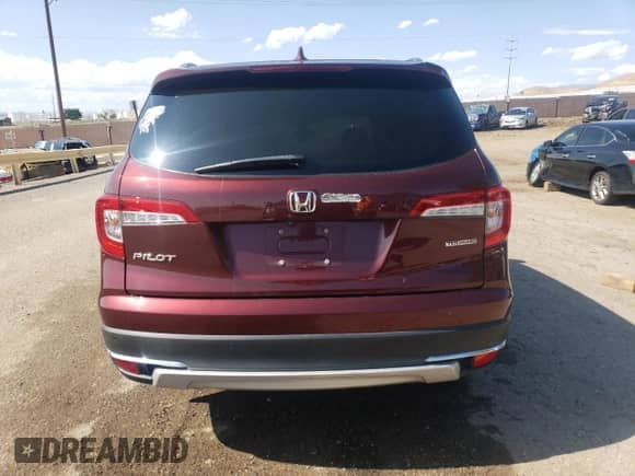 2021 Honda Pilot Touring 8-Passenger z VIN 5FNYF5H97MB024661, wystawiony jako Copart lot #59338055 z przebiegiem Nie podano mil oraz Szkoda całkowita • Salvage title. Historia ofert i sprzedaży dostępna na DreamBid. Obrazek 6.