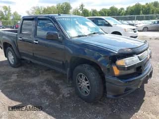 2011 Chevrolet Colorado 1LT z VIN 1GCHTCFE7B8136127, wystawiony jako IAAI lot #43083805 z przebiegiem 130 785 mil mil oraz . Historia ofert i sprzedaży dostępna na DreamBid. Obrazek 1.