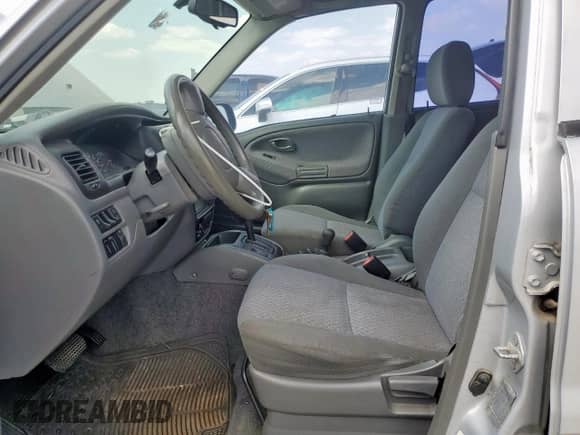 1999 Chevrolet Tracker with VIN 2CNBJ13CXX6913167, listed as a Copart auction lot 84390725 with 205,011 mi miles and Clean title. Bid and sale history available at DreamBid. Image 7.
