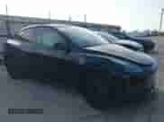 2023 Tesla Model Y Long Range z VIN 7SAYGAEE7PF767951, wystawiony jako IAAI lot #43128878 z przebiegiem 36 431 mil mil oraz . Historia ofert i sprzedaży dostępna na DreamBid. Obrazek 1.