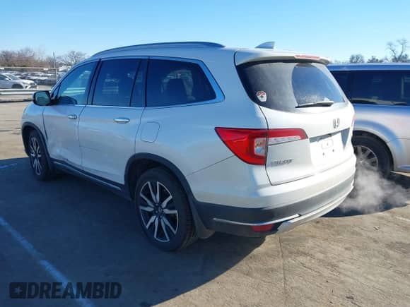 2021 Honda Pilot Touring 7-Passenger with VIN 5FNYF5H64MB031671, listed as a IAAI auction lot 41332415 with 90,411 mi miles and . Bid and sale history available at DreamBid. Image 3.