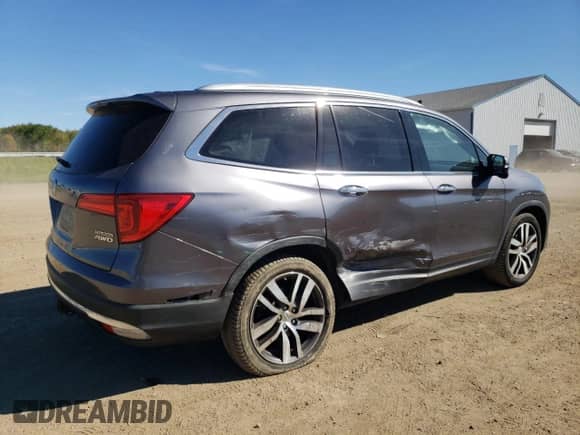 2017 Honda Pilot Touring z VIN 5FNYF6H95HB054723, wystawiony jako Copart lot #84872875 z przebiegiem 127 730 mil mil oraz Szkoda całkowita • Salvage title. Historia ofert i sprzedaży dostępna na DreamBid. Obrazek 3.