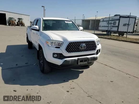 2018 Toyota Tacoma SR5 z VIN 3TMBZ5DN7JM014784, wystawiony jako Copart lot #55620295 z przebiegiem 69 331 mil mil oraz Szkoda całkowita • Salvage title. Historia ofert i sprzedaży dostępna na DreamBid. Obrazek 13.