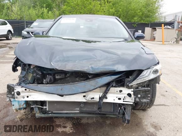 2021 Toyota Camry Hybrid XLE with VIN 4T1F31AK8MU563752, listed as a IAAI auction lot 42134620 with 19,484 mi miles and . Bid and sale history available at DreamBid. Image 6.