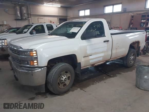 2015 Chevrolet Silverado 2500HD Work Truck with VIN 1GC0KUEG8FZ111083, listed as a IAAI auction lot 41425303 with 219,829 mi miles and . Bid and sale history available at DreamBid. Image 2.
