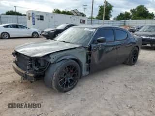 2010 Dodge Charger R/T with VIN 2B3CA5CT9AH183457, listed as a Copart auction lot 57784955 with 213,951 mi miles and Salvage title. Bid and sale history available at DreamBid. Image 1.