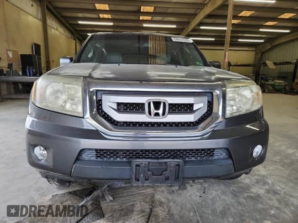 2011 Honda Pilot EX-L z VIN 5FNYF4H7XBB084519, wystawiony jako Copart lot #68644595 z przebiegiem 186 578 mil mil oraz Szkoda całkowita • Salvage title. Historia ofert i sprzedaży dostępna na DreamBid. Obrazek 5.