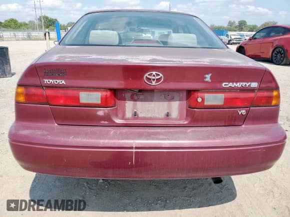 1997 Toyota Camry LE с VIN 4T1BF22K8VU033857, выставлен на аукционе Copart как лот 71679065 с пробегом 150 448 миль миль и Списание • Salvage title. История ставок и продаж доступна на DreamBid. Изображение 6.