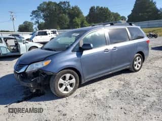 2015 Toyota Sienna LE with VIN 5TDKK3DC1FS602128, listed as a Copart auction lot 81999585 with 134,271 mi miles and Salvage title. Bid and sale history available at DreamBid. Image 1.
