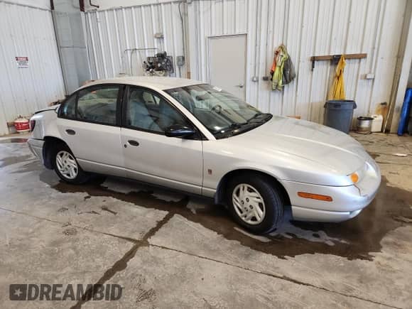 2002 Saturn SL with VIN 1G8ZF52892Z193411, listed as a Copart auction lot 69932745 with 136,835 mi miles and Non repairable. Bid and sale history available at DreamBid. Image 4.