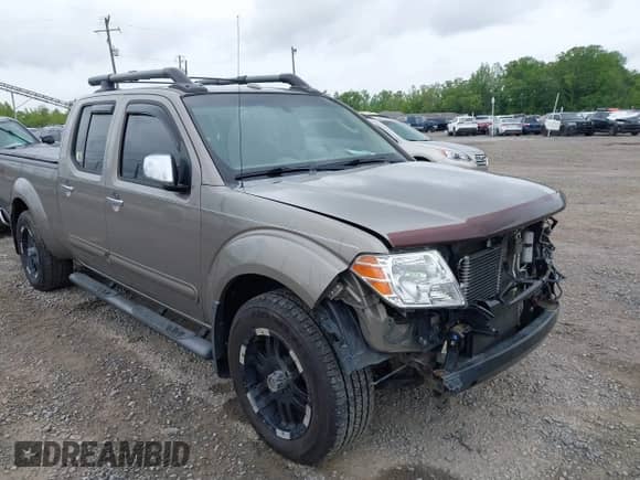 2009 Nissan Frontier SE with VIN 1N6AD09WX9C423595, listed as a IAAI auction lot 42210046 with 117,142 mi miles and . Bid and sale history available at DreamBid. Image 1.