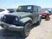 2015 Jeep Wrangler Sport with VIN 1C4AJWAGXFL650428, listed as a IAAI auction lot 42010629 with 80,039 mi miles and . Bid and sale history available at DreamBid. Image 2.