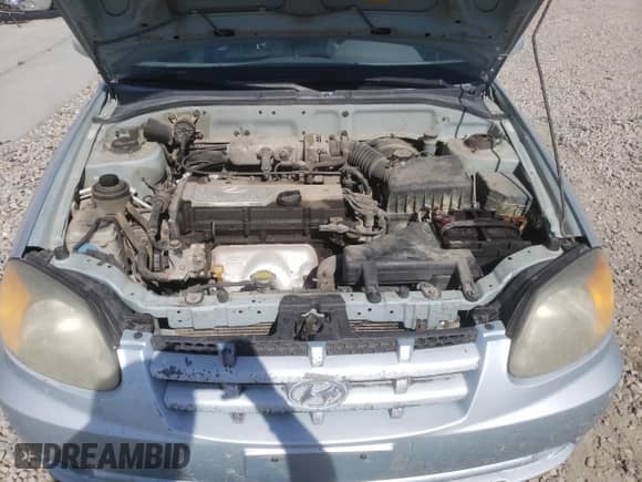 2005 Hyundai Accent GLS z VIN KMHCG35C55U341192, wystawiony jako Copart lot #70708994 z przebiegiem 174 872 mil mil oraz Szkoda całkowita • Salvage title. Historia ofert i sprzedaży dostępna na DreamBid. Obrazek 12.