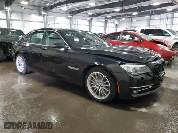 2013 BMW 7 Series 750i xDrive with VIN WBAYB6C59DD223852, listed as a Copart auction lot 49304695 with 124,989 mi miles and Salvage title. Bid and sale history available at DreamBid. Image 4.