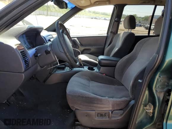 1999 Jeep Grand Cherokee Laredo с VIN 1J4GW58S7XC568362, выставлен на аукционе Copart как лот 58078175 с пробегом 148 369 миль миль и Списание • Salvage title. История ставок и продаж доступна на DreamBid. Изображение 7.