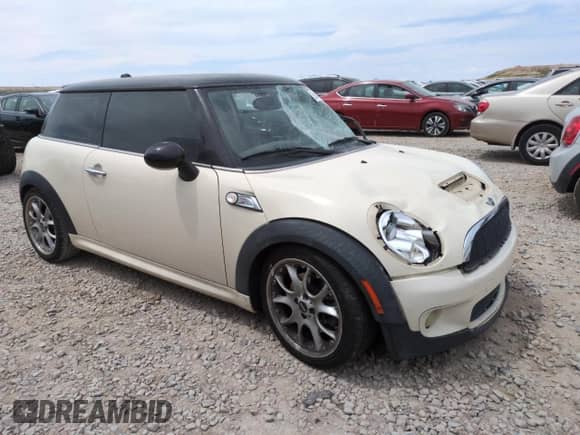 2009 MINI Hardtop S with VIN WMWMF73569TW87347, listed as a Copart auction lot 59445035 with 118,336 mi miles and Salvage title. Bid and sale history available at DreamBid. Image 4.