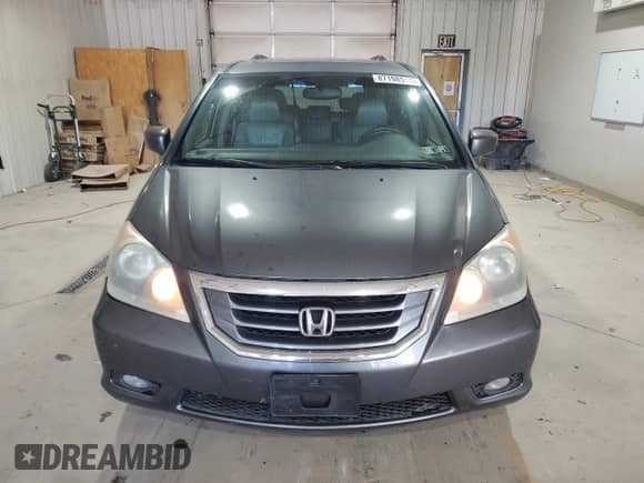 2010 Honda Odyssey Touring with VIN 5FNRL3H99AB018910, listed as a Copart auction lot 87198515 with 194,164 mi miles and Salvage title. Bid and sale history available at DreamBid. Image 5.