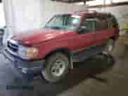 2000 Ford Explorer XLT with VIN 1FMZU73E5YZA24468, listed as a Copart auction lot 82210305 with 125,033 mi miles and Salvage title. Bid and sale history available at DreamBid. Image 1.