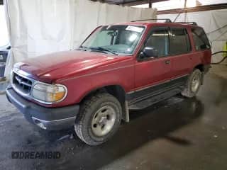 2000 Ford Explorer XLT with VIN 1FMZU73E5YZA24468, listed as a Copart auction lot 82210305 with 125,033 mi miles and Salvage title. Bid and sale history available at DreamBid. Image 1.