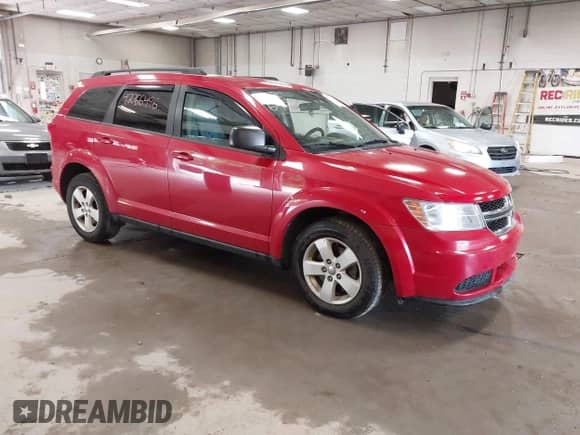 2014 Dodge Journey SE z VIN 3C4PDDAG5ET291031, wystawiony jako IAAI lot #42766496 z przebiegiem 227 965 mil mil oraz . Historia ofert i sprzedaży dostępna na DreamBid. Obrazek 1.