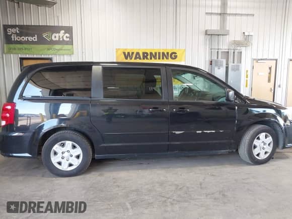 2012 Dodge Grand Caravan American Value z VIN 2C4RDGBG7CR104770, wystawiony jako IAAI lot #42640518 z przebiegiem 108 356 mil mil oraz . Historia ofert i sprzedaży dostępna na DreamBid. Obrazek 13.