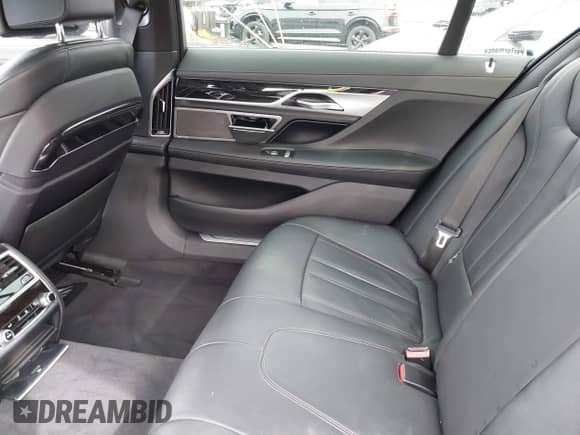 2019 BMW 7 Series 740i with VIN WBA7E2C57KB217973, listed as a IAAI auction lot 39064321 with 54,818 mi miles and . Bid and sale history available at DreamBid. Image 8.