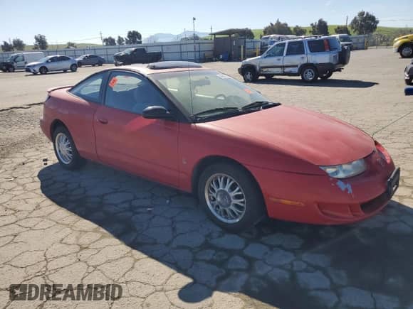 1999 Saturn SC с VIN 1G8ZY127XXZ314531, выставлен на аукционе Copart как лот 49653805 с пробегом 130 457 миль миль и Списание • Salvage title. История ставок и продаж доступна на DreamBid. Изображение 4.