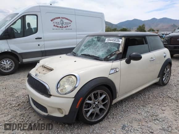 2009 MINI Hardtop S with VIN WMWMF73569TW87347, listed as a Copart auction lot 59445035 with 118,336 mi miles and Salvage title. Bid and sale history available at DreamBid. Image 1.