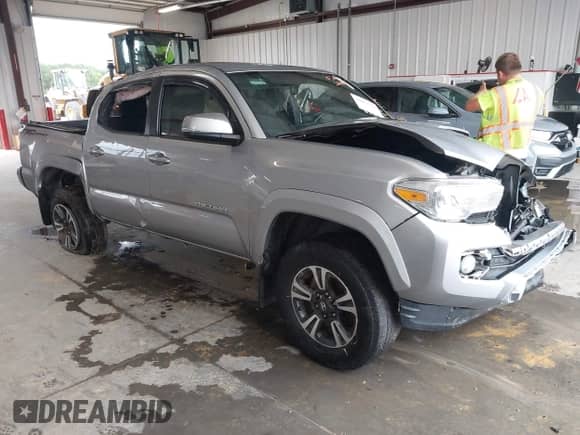 2017 Toyota Tacoma SR5 with VIN 5TFAZ5CN9HX031054, listed as a IAAI auction lot 42977558 with 150,662 mi miles and . Bid and sale history available at DreamBid. Image 1.