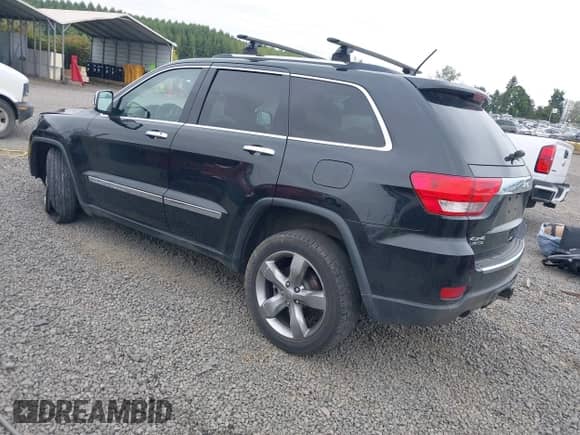 2013 Jeep Grand Cherokee Limited z VIN 1C4RJFBT4DC503856, wystawiony jako IAAI lot #43166356 z przebiegiem 143 262 mil mil oraz . Historia ofert i sprzedaży dostępna na DreamBid. Obrazek 3.