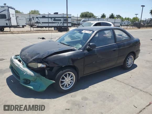 1999 Hyundai Accent L with VIN KMHVD14N4XU428030, listed as a Copart auction lot 65271195 with 151,064 mi miles and Salvage title. Bid and sale history available at DreamBid. Image 1.