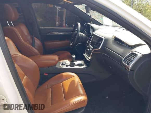 2015 Jeep Grand Cherokee SRT z VIN 1C4RJFDJ5FC647995, wystawiony jako IAAI lot #42276301 z przebiegiem 141 332 mil mil oraz . Historia ofert i sprzedaży dostępna na DreamBid. Obrazek 5.