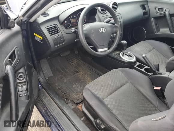 2006 Hyundai Tiburon GS с VIN KMHHM65D26U229878, выставлен на аукционе Copart как лот 70600534 с пробегом 140 245 миль миль и Списание • Salvage title. История ставок и продаж доступна на DreamBid. Изображение 8.
