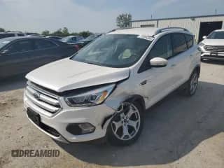 2017 Ford Escape Titanium with VIN 1FMCU0J96HUD56824, listed as a Copart auction lot 71854385 with 81,685 mi miles and Salvage title. Bid and sale history available at DreamBid. Image 1.