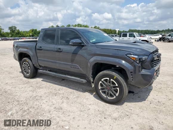 2024 Toyota Tacoma SR5 with VIN 3TMLB5JN1RM024042, listed as a Copart auction lot 70640855 with 23,853 mi miles and Salvage title. Bid and sale history available at DreamBid. Image 4.
