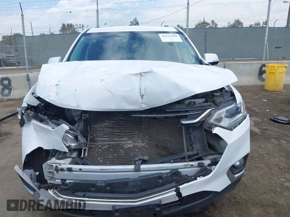 2018 Chevrolet Traverse LT Cloth z VIN 1GNEVGKW5JJ264075, wystawiony jako IAAI lot #43115703 z przebiegiem 121 358 mil mil oraz . Historia ofert i sprzedaży dostępna na DreamBid. Obrazek 12.