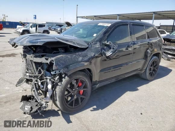 2016 Jeep Grand Cherokee SRT z VIN 1C4RJFDJ3GC454648, wystawiony jako Copart lot #57988235 z przebiegiem 104 364 mil mil oraz Szkoda całkowita • Salvage title. Historia ofert i sprzedaży dostępna na DreamBid. Obrazek 1.