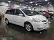 2004 Toyota Sienna XLE z VIN 5TDBA22C54S008865, wystawiony jako Copart lot #67295945 z przebiegiem 276 878 mil mil oraz Szkoda całkowita • Salvage title. Historia ofert i sprzedaży dostępna na DreamBid. Obrazek 4.