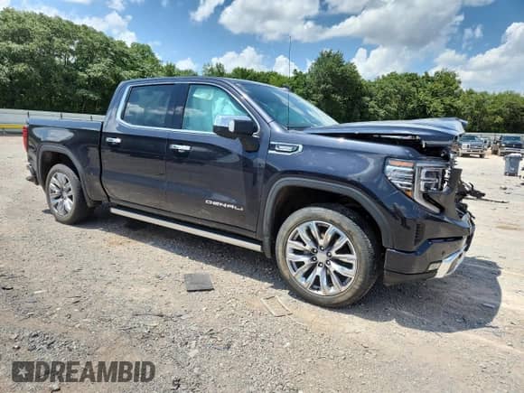 2023 GMC Sierra 1500 Denali with VIN 1GTUUGE88PZ274498, listed as a Copart auction lot 64927885 with 28,326 mi miles and Salvage title. Bid and sale history available at DreamBid. Image 4.