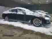2017 BMW 7 Series 740i xDrive with VIN WBA7E4C55HGU99781, listed as a Copart auction lot 42806505 with 74,825 mi miles and Salvage title. Bid and sale history available at DreamBid. Image 4.