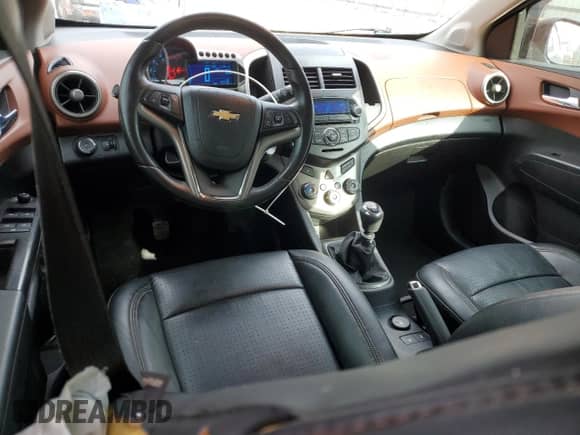2012 Chevrolet Sonic LTZ с VIN 1G1JF6SH2C4113477, выставлен на аукционе Copart как лот 87371614 с пробегом 90 981 миль миль и Списание • Salvage title. История ставок и продаж доступна на DreamBid. Изображение 8.