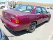 1996 Toyota Camry LE z VIN 4T1BF12K1TU129000, wystawiony jako IAAI lot #42294535 z przebiegiem 157 851 mil mil oraz . Historia ofert i sprzedaży dostępna na DreamBid. Obrazek 4.