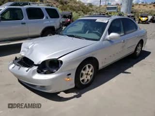 2001 Hyundai Sonata GLS with VIN KMHWF35V81A392523, listed as a Copart auction lot 74584334 with 174,597 mi miles and Salvage title. Bid and sale history available at DreamBid. Image 1.