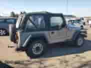 2000 Jeep Wrangler SE with VIN 1J4FA29P4YP775935, listed as a Copart auction lot 80458955 with 100,211 mi miles and Salvage title. Bid and sale history available at DreamBid. Image 3.