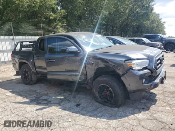 2021 Toyota Tacoma SR with VIN 3TMCZ5AN3MM416508, listed as a Copart auction lot 70862725 with 73,141 mi miles and Salvage title. Bid and sale history available at DreamBid. Image 4.