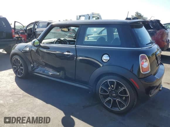2012 MINI Hardtop S with VIN WMWSV3C59CT387246, listed as a Copart auction lot 61766125 with 155,156 mi miles and Salvage title. Bid and sale history available at DreamBid. Image 2.
