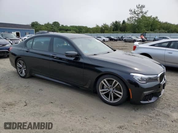 2019 BMW 7 Series 740i xDrive with VIN WBA7E4C5XKGV70108, listed as a Copart auction lot 67403785 with 62,574 mi miles and Salvage title. Bid and sale history available at DreamBid. Image 4.