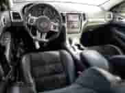 2012 Jeep Grand Cherokee SRT-8 z VIN 1C4RJFDJ7CC100156, wystawiony jako Copart lot #79865954 z przebiegiem 113 782 mil mil oraz Szkoda całkowita • Salvage title. Historia ofert i sprzedaży dostępna na DreamBid. Obrazek 8.